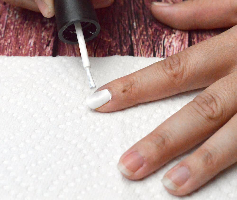 Painting nails with white nail polish