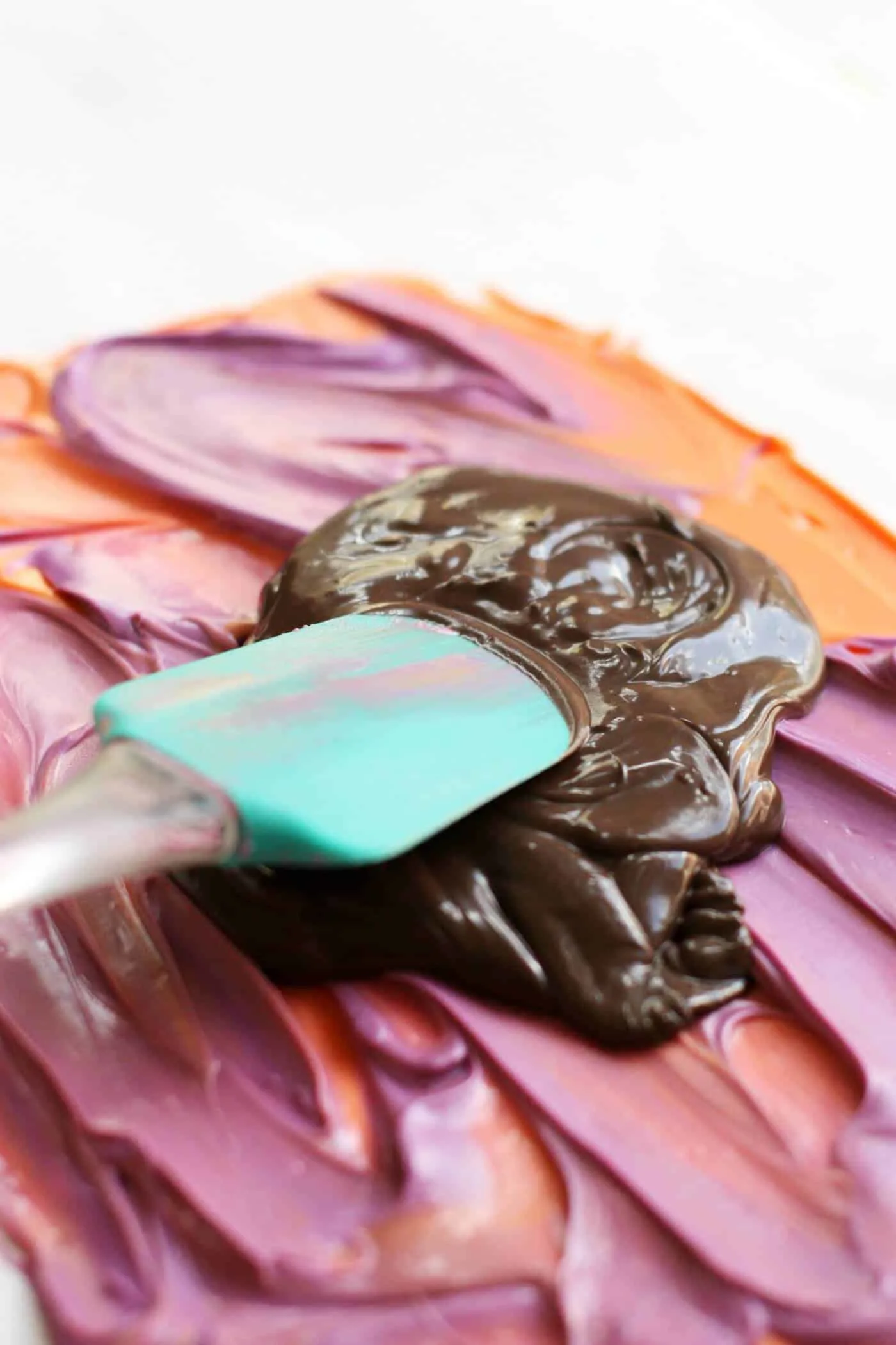 Halloween candy melts smoothing with a spatula