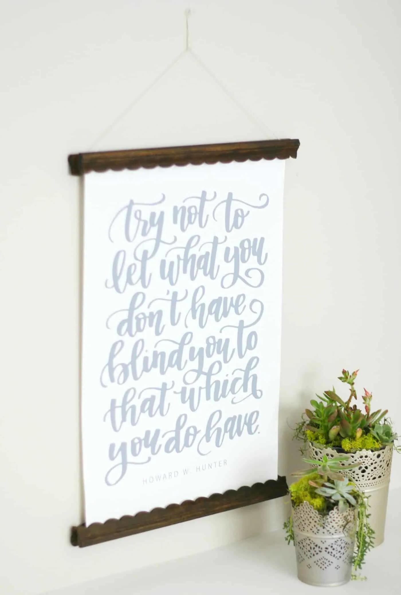 https://diycandy.b-cdn.net/wp-content/uploads/2016/11/Simple-DIY-poster-hanger.jpg.webp