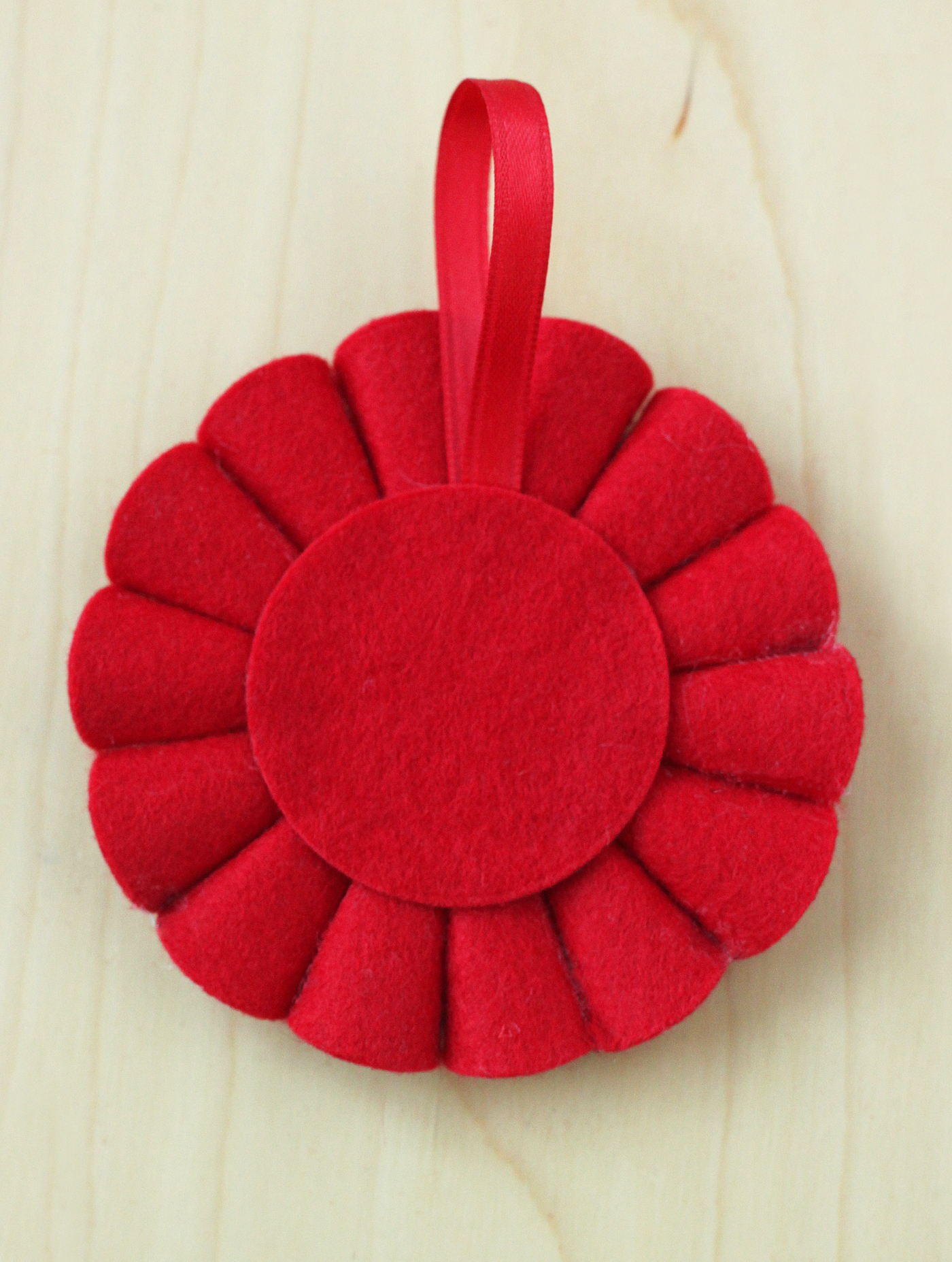 Felt circle and ribbon glued to the back of an ornament