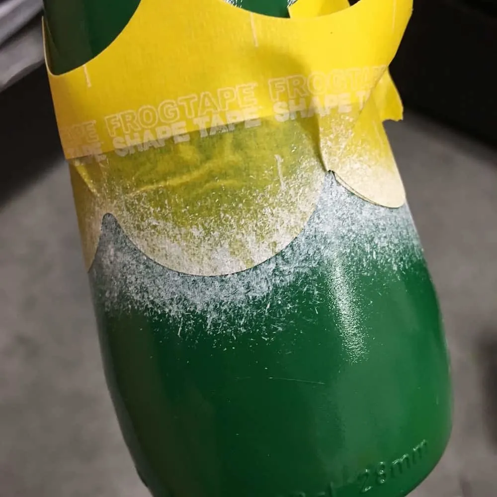 White paint on a bottle being used to create a snow like effect
