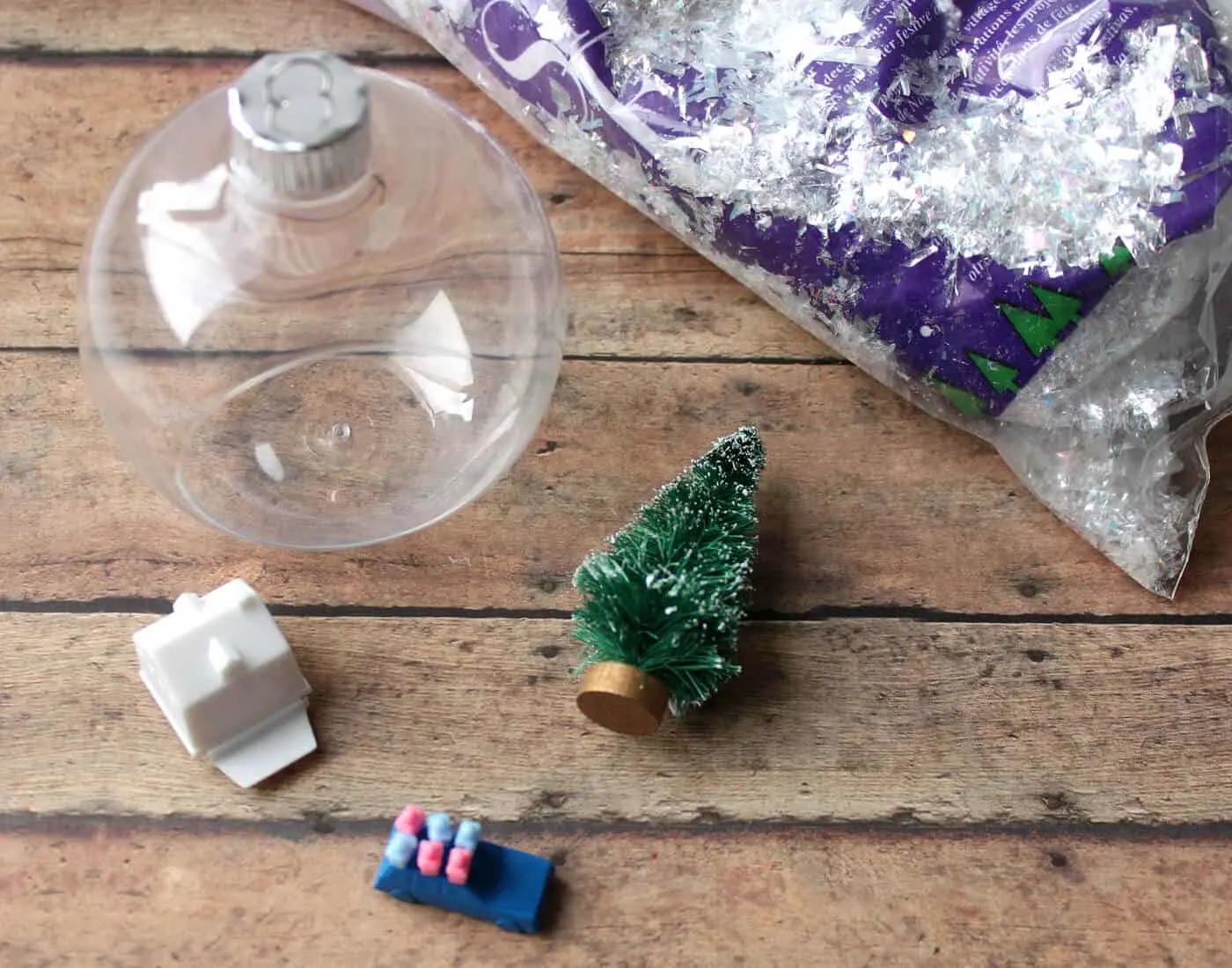 Clear christmas ornament, faux snow, small bristle brush tree, Game of Life game pieces