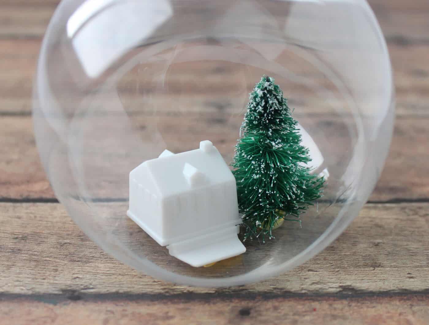 Tree and house glued into the bottom of the clear ornament