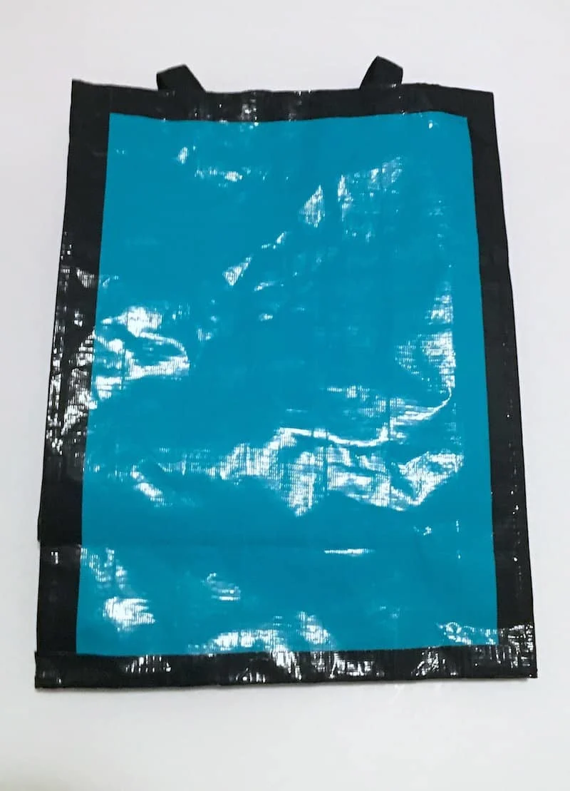 Bag covered in black and aqua Duck Tape