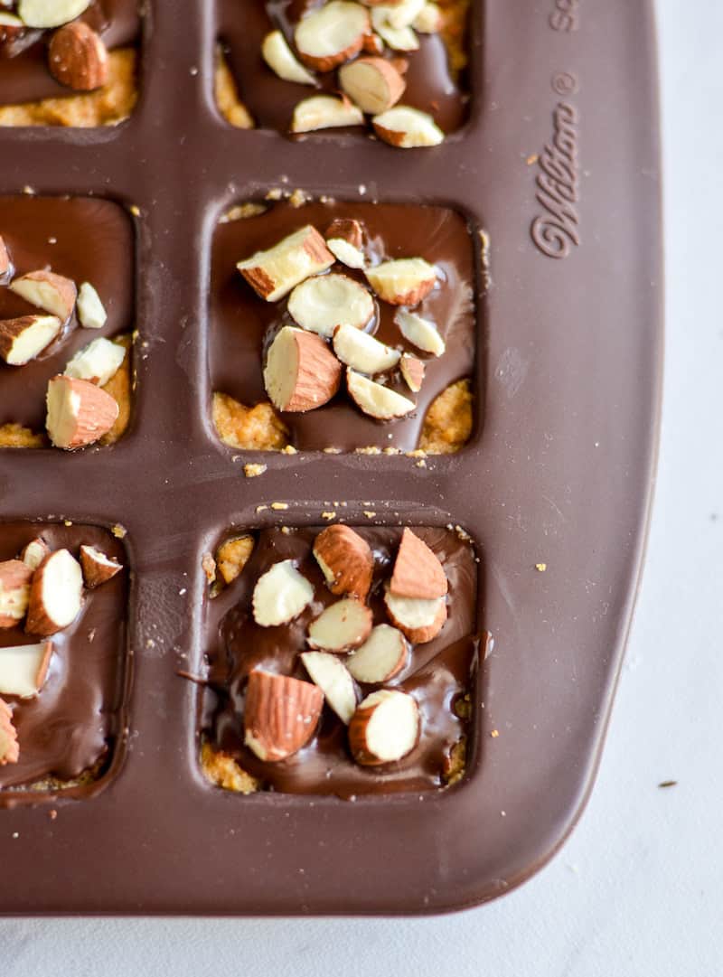 Pumpkin chocolate fat bombs with roasted almonds on top