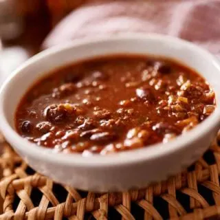 This healthy three bean and ground lean meat Weight Watchers chili recipe is ZERO points on the Freestyle program! It's filling and delicious. Make in the pressure cooker or crockpot!