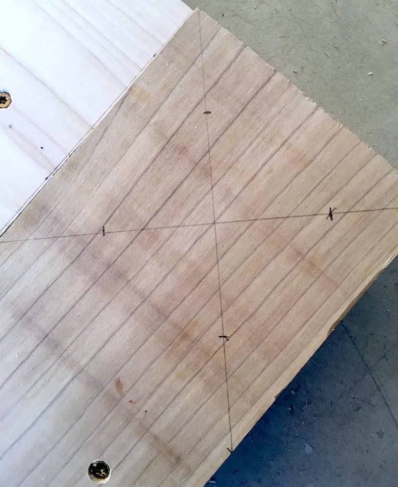 Screw locations drawn with an X on the wood