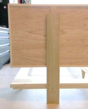 headboard mounted to the support pieces with wood screws