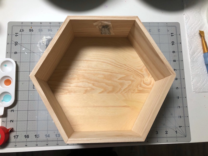 Wood hexagon shelf on a craft mat