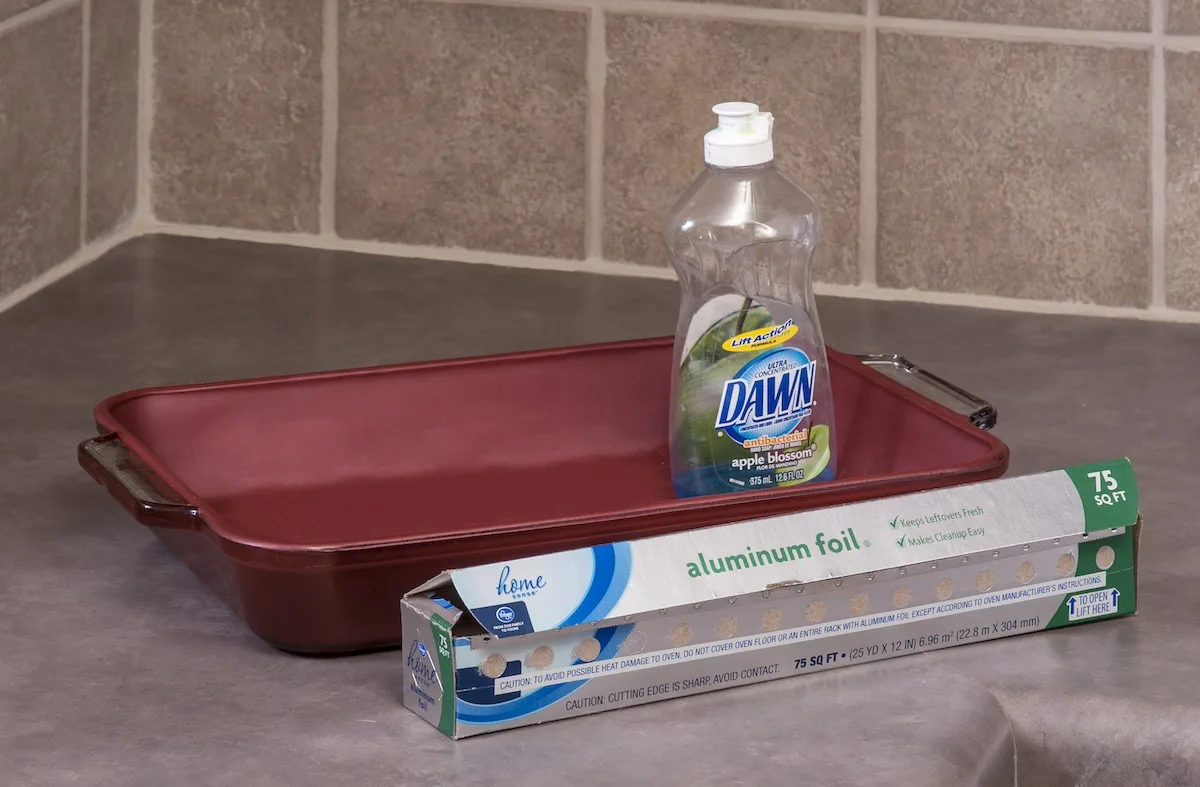 Cleaning glass cookware with dish soap and aluminum foil