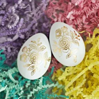 Easter eggs with tattoos on paper shreds