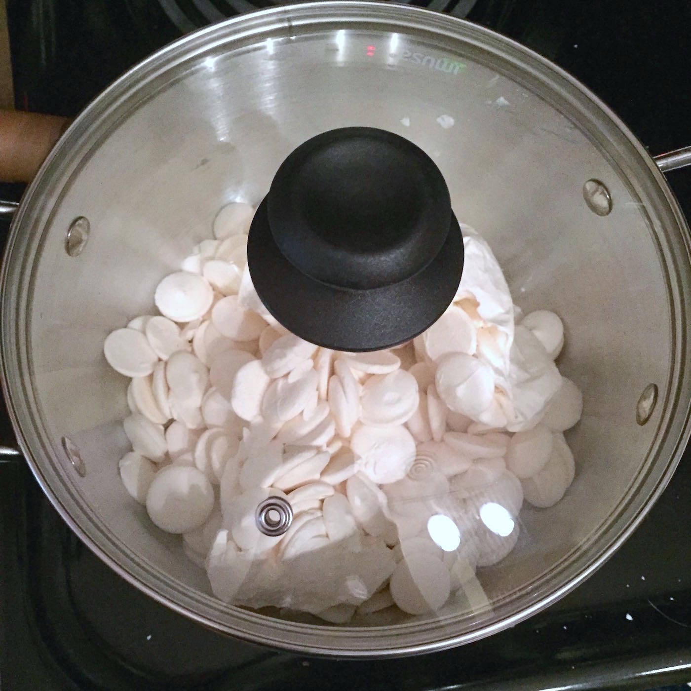 Candy melts in a sauce pan with the lid on