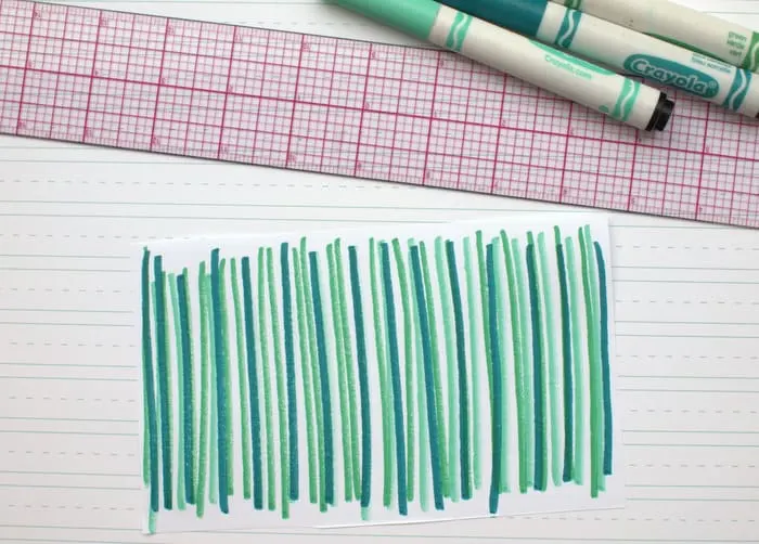Lines drawn on paper in two colors of green marker