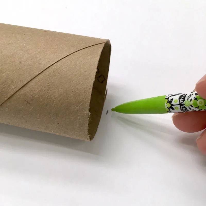 Trace a toilet paper roll on the back of paper with a pencil