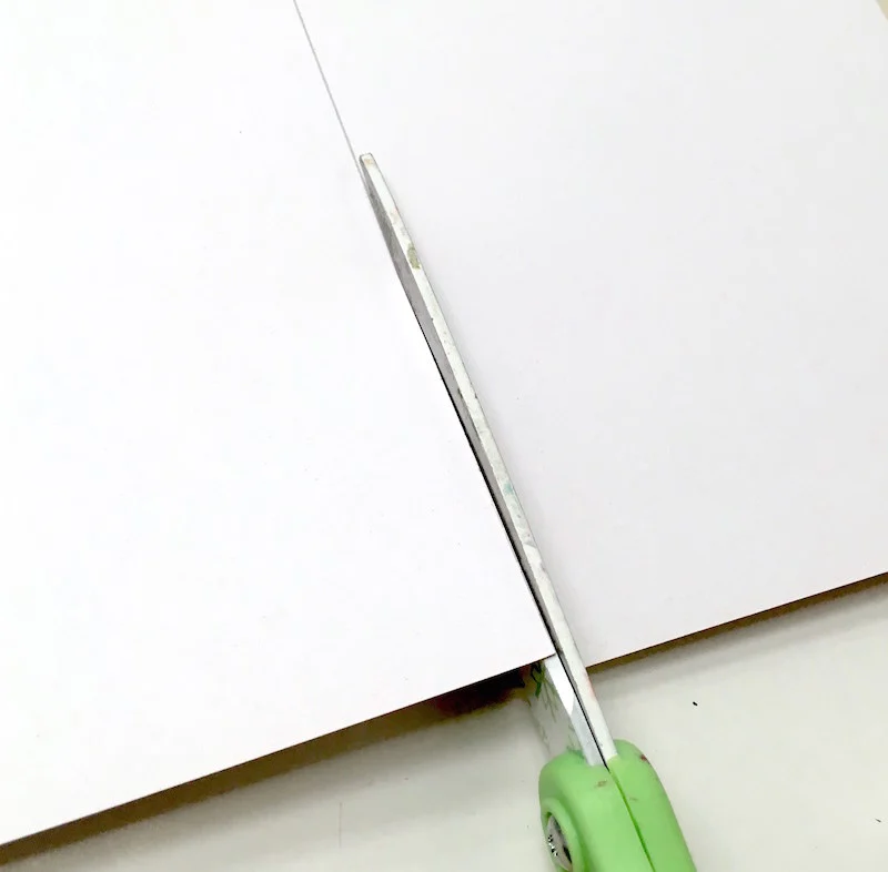 Cutting scrapbook paper with scissors