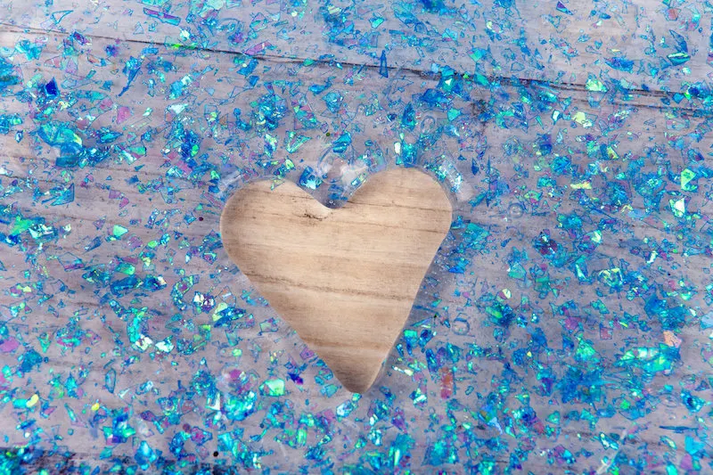 Blue confetti slime with a heart cut out of the center