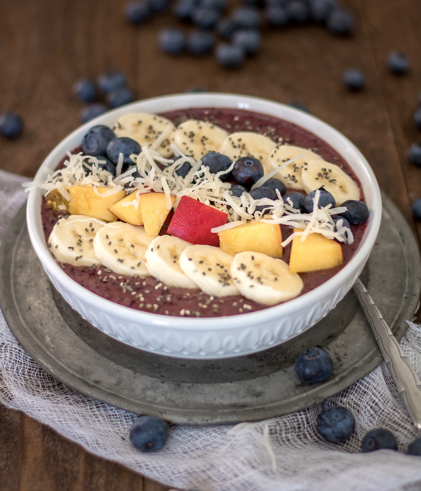 smoothie bowl with blueberry, banana, chia seeds, and coconut