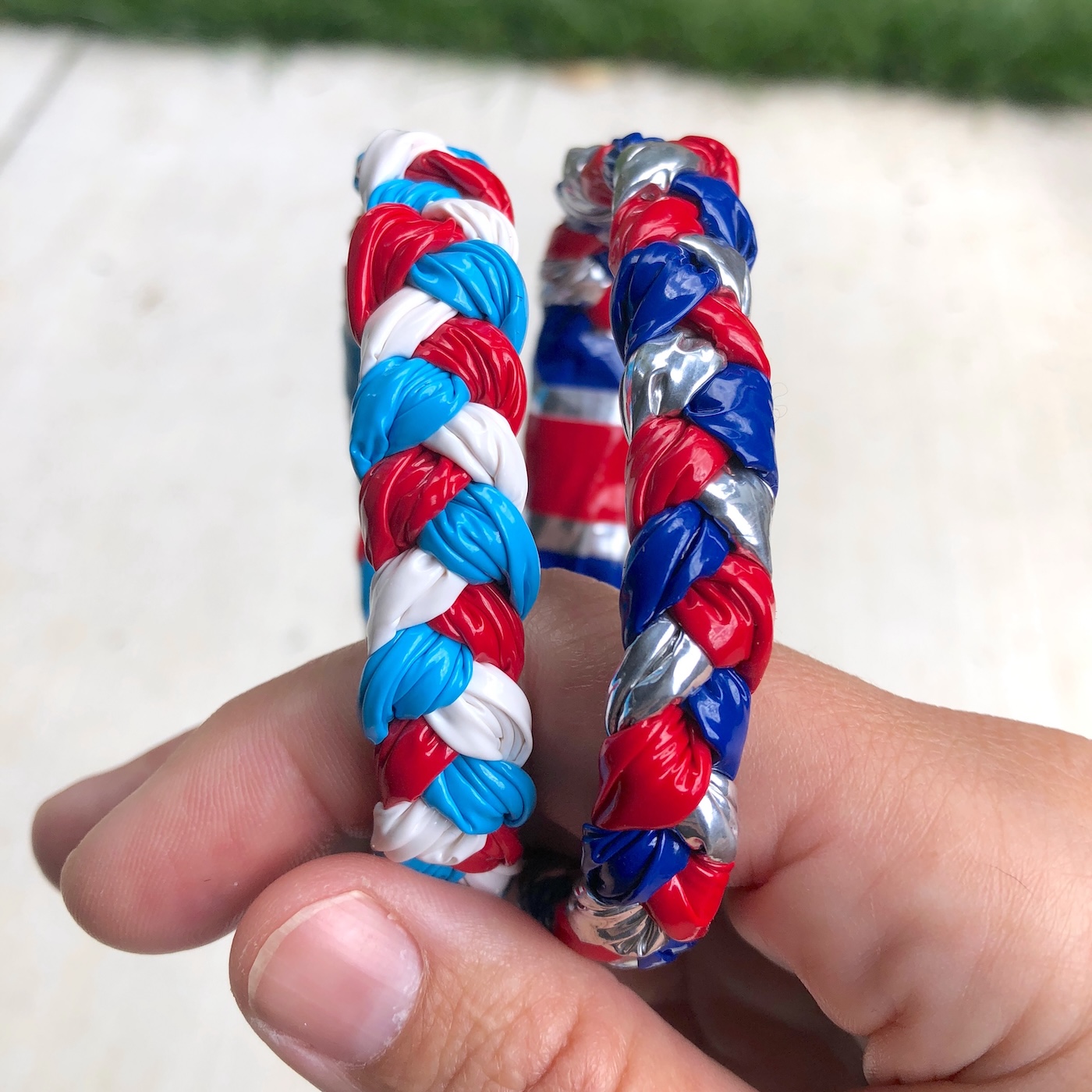 hand holding bracelets made of duct tape