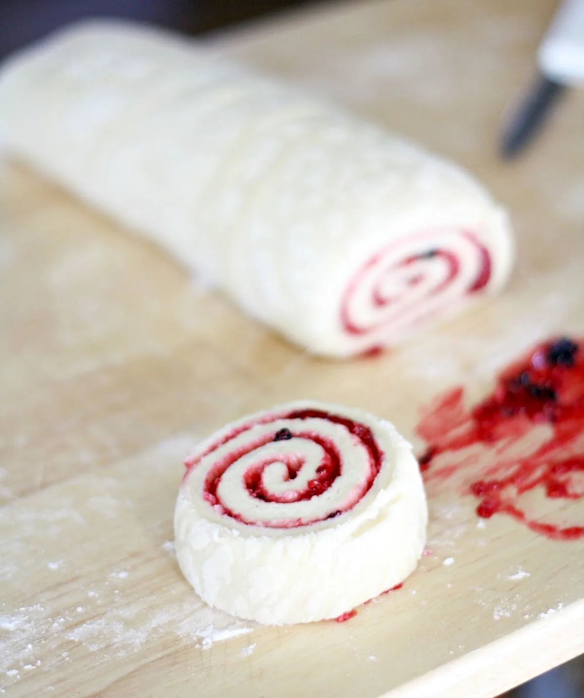 Cutting a roll off the dough log