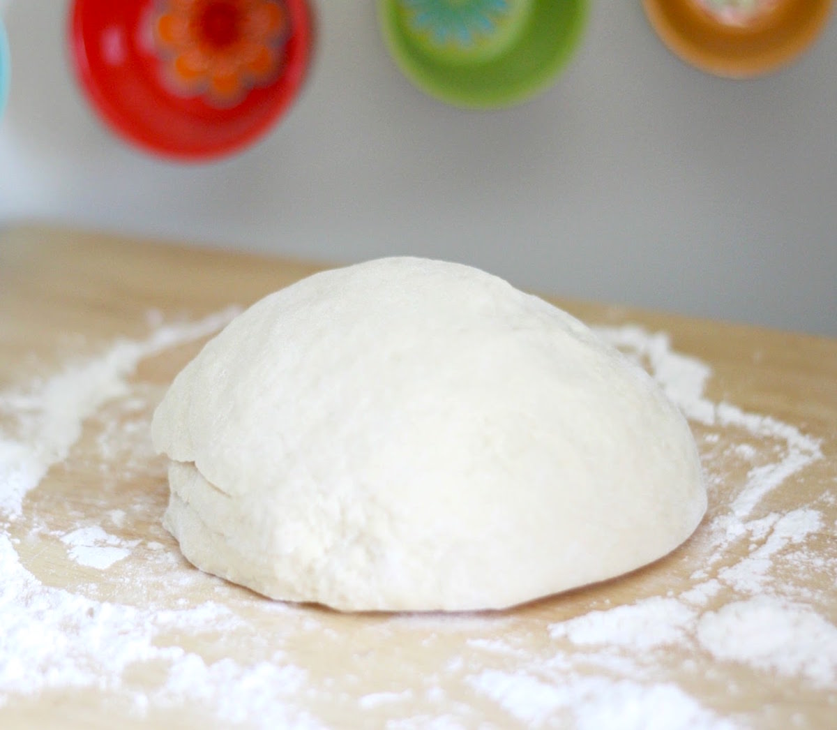 Kneaded dough on a floured surface