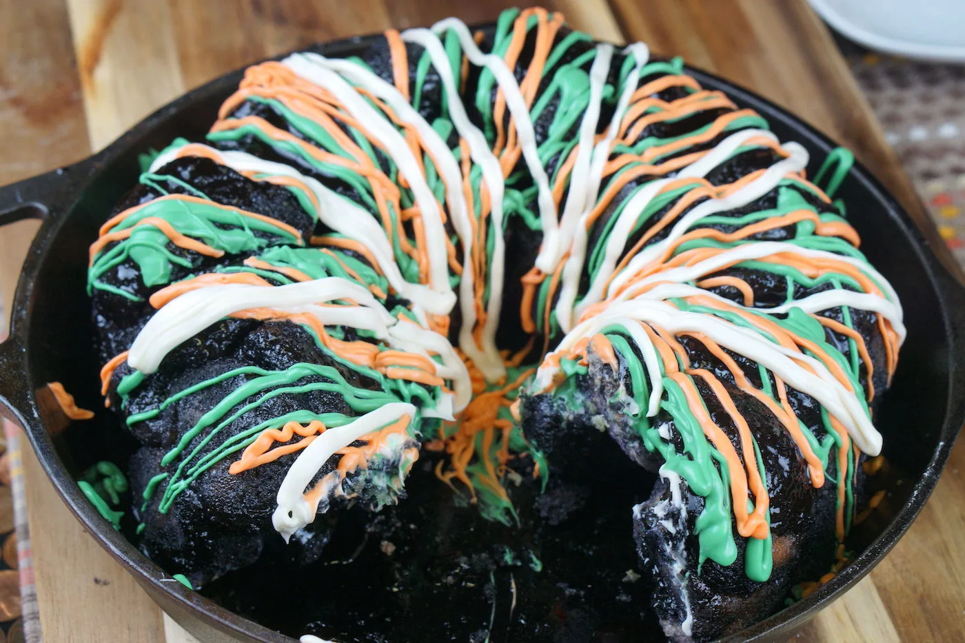 Black halloween monkey bread with a piece cut out