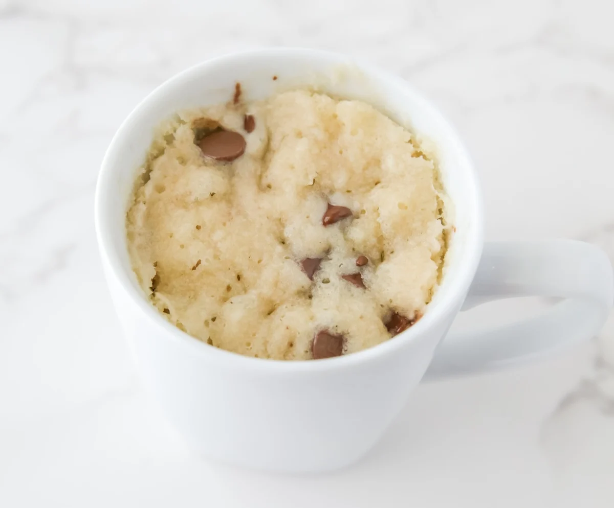 Cooked mug cake starting to pull away from the side of the mug