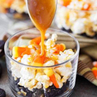 Drizzling caramel on top of the candy corn and popcorn