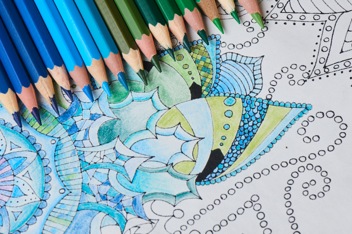 Colored-pencils-sitting-on-top-of-coloring-page