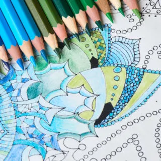Coloring-page-with-blue-colored-pencils on top