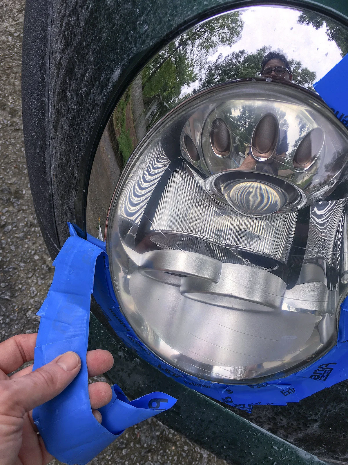 Removing painter's tape from the DIY headlight restoration