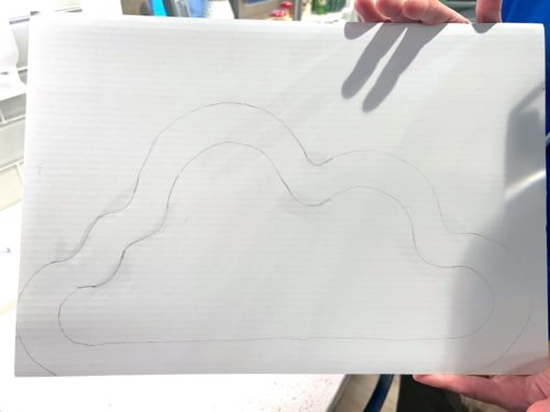 cloud design drawn on cardboard