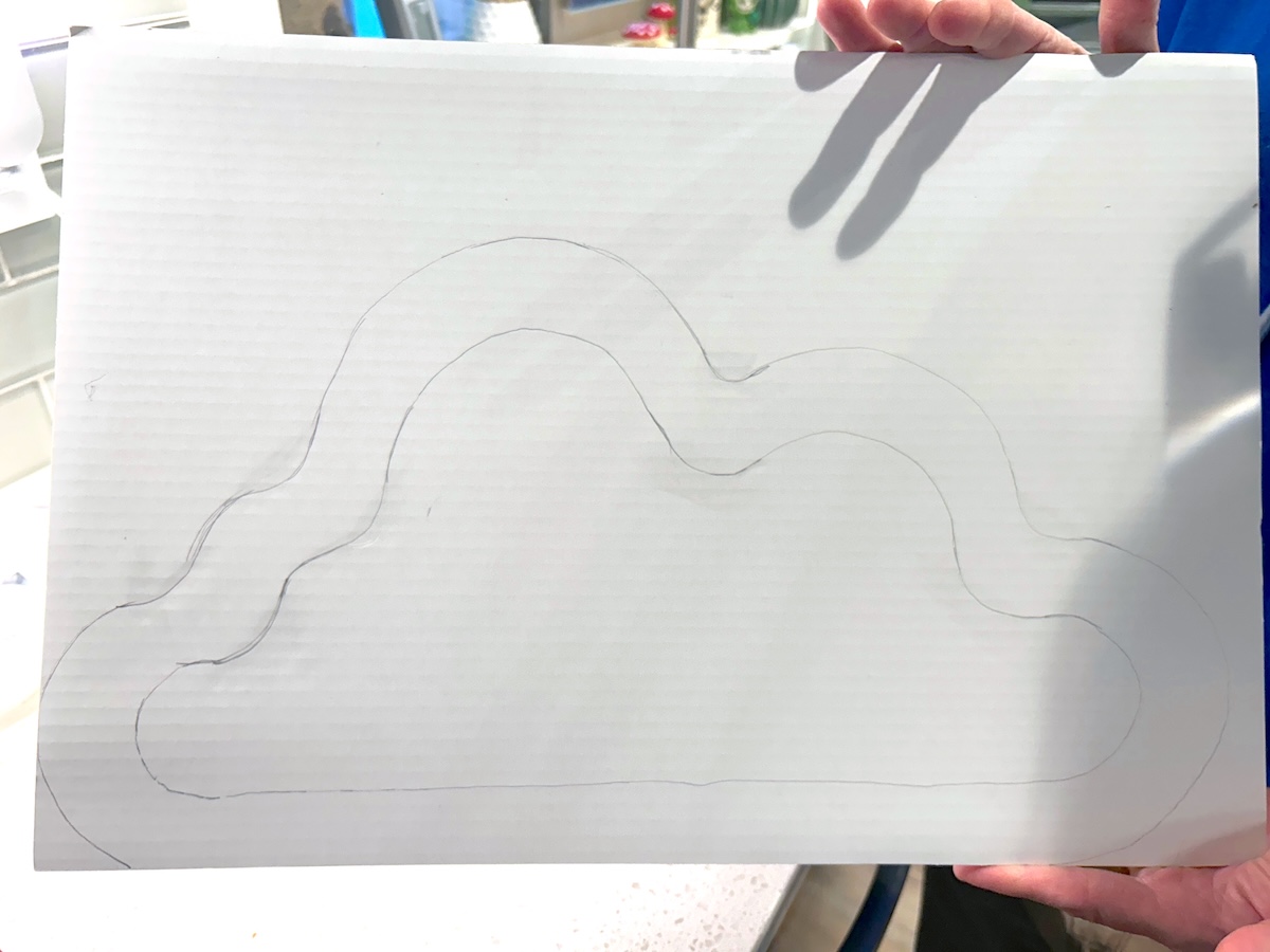 cloud design drawn on cardboard