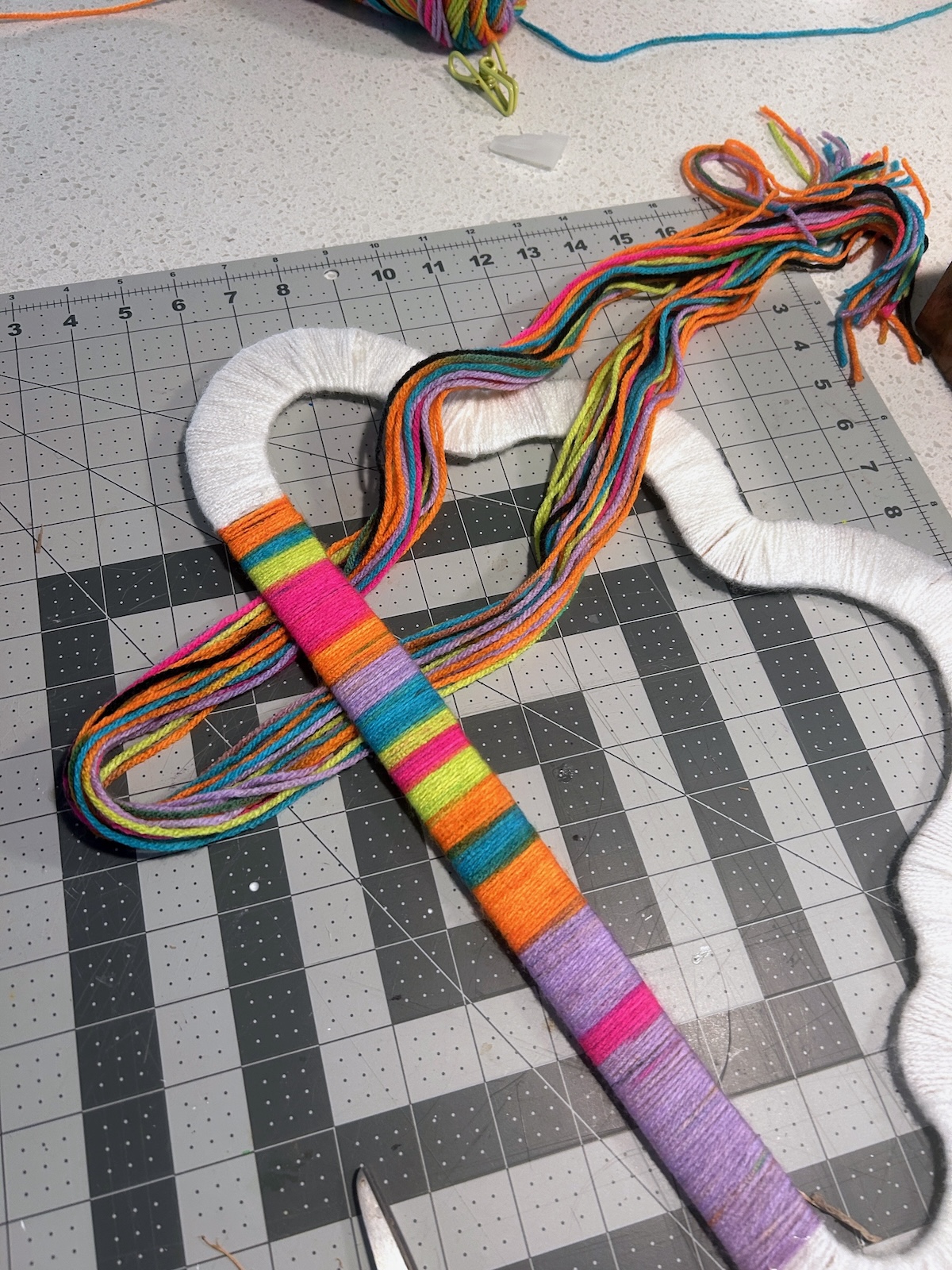 looping yarn over the bottom of the cloud shape