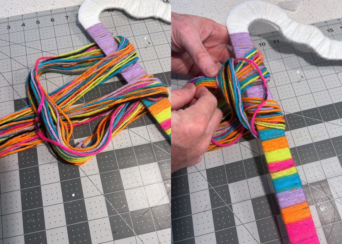 tightening the rainbow yarn onto the bottom of the cloud