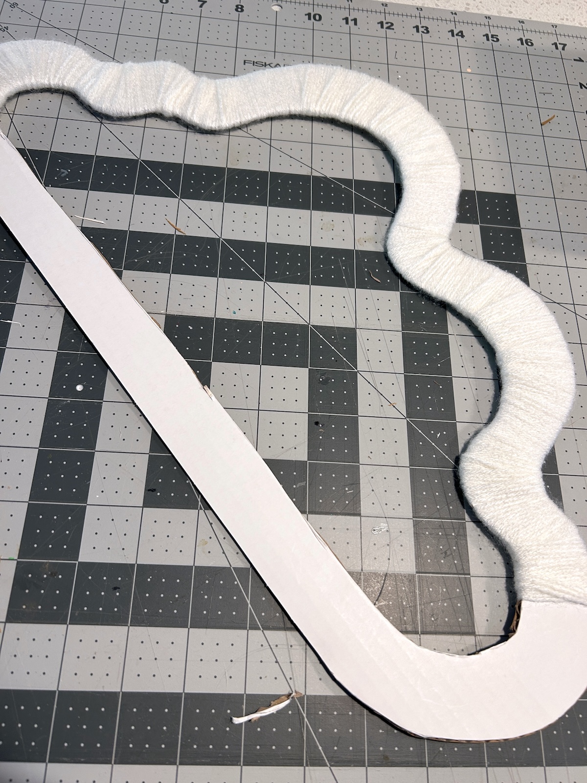 white yarn completely wrapped around the top of the cloud