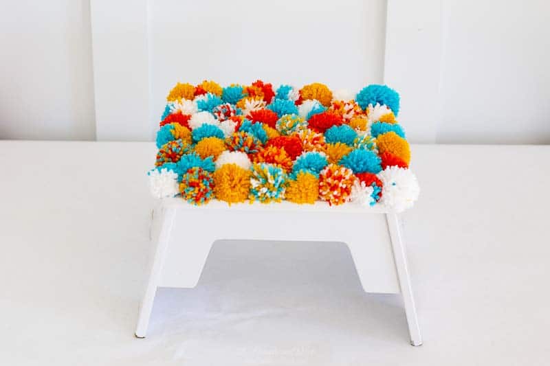 DIY pom pom footstool