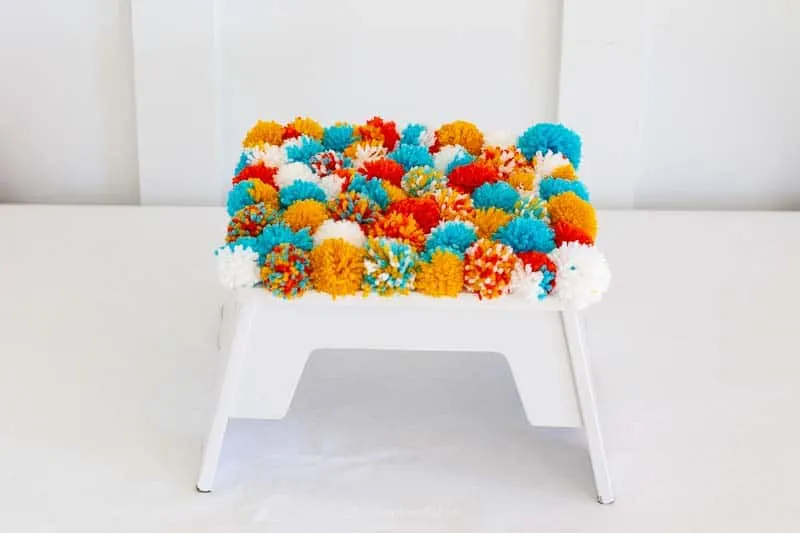 DIY pom pom footstool