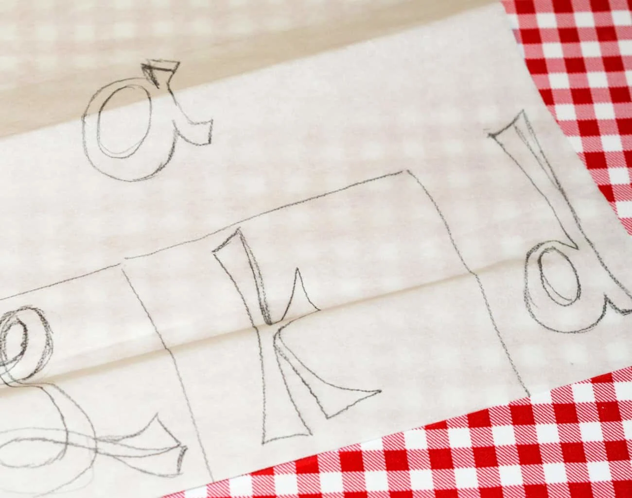 Letters drawn onto a steam-a-seam sheet with pencil