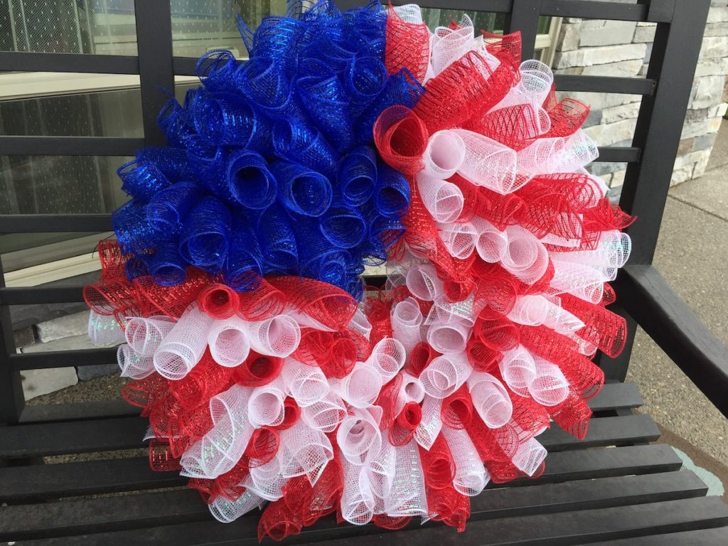 4th-of-July-mesh-wreath-sitting-on-a-bench