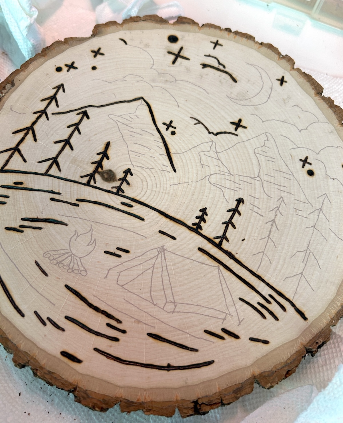 burned scene on wood