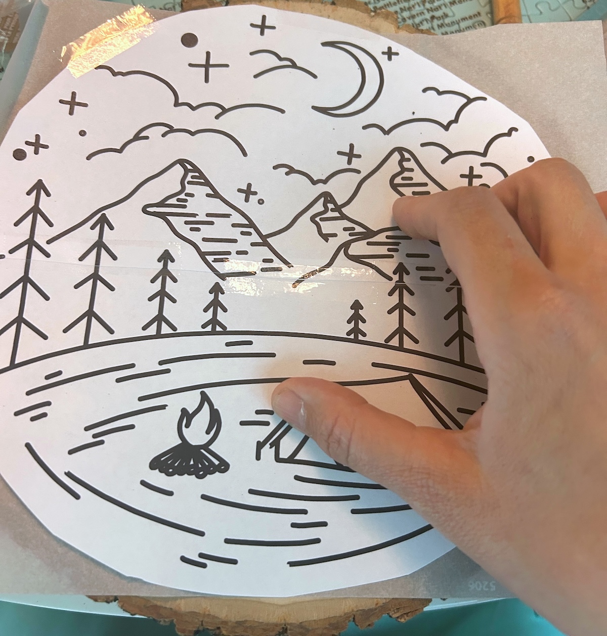 transfer paper and printed design on the front of the wood