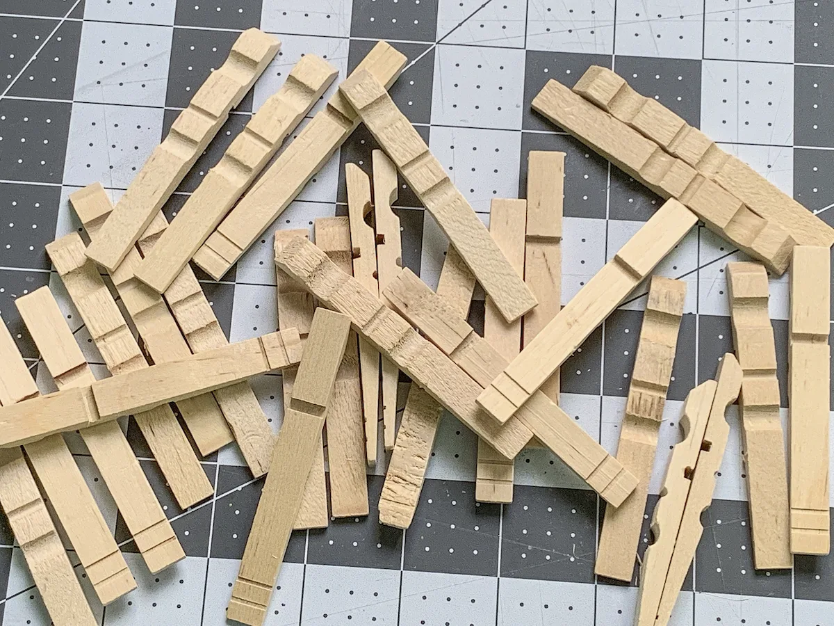 Pile of wooden clothespins with no springs