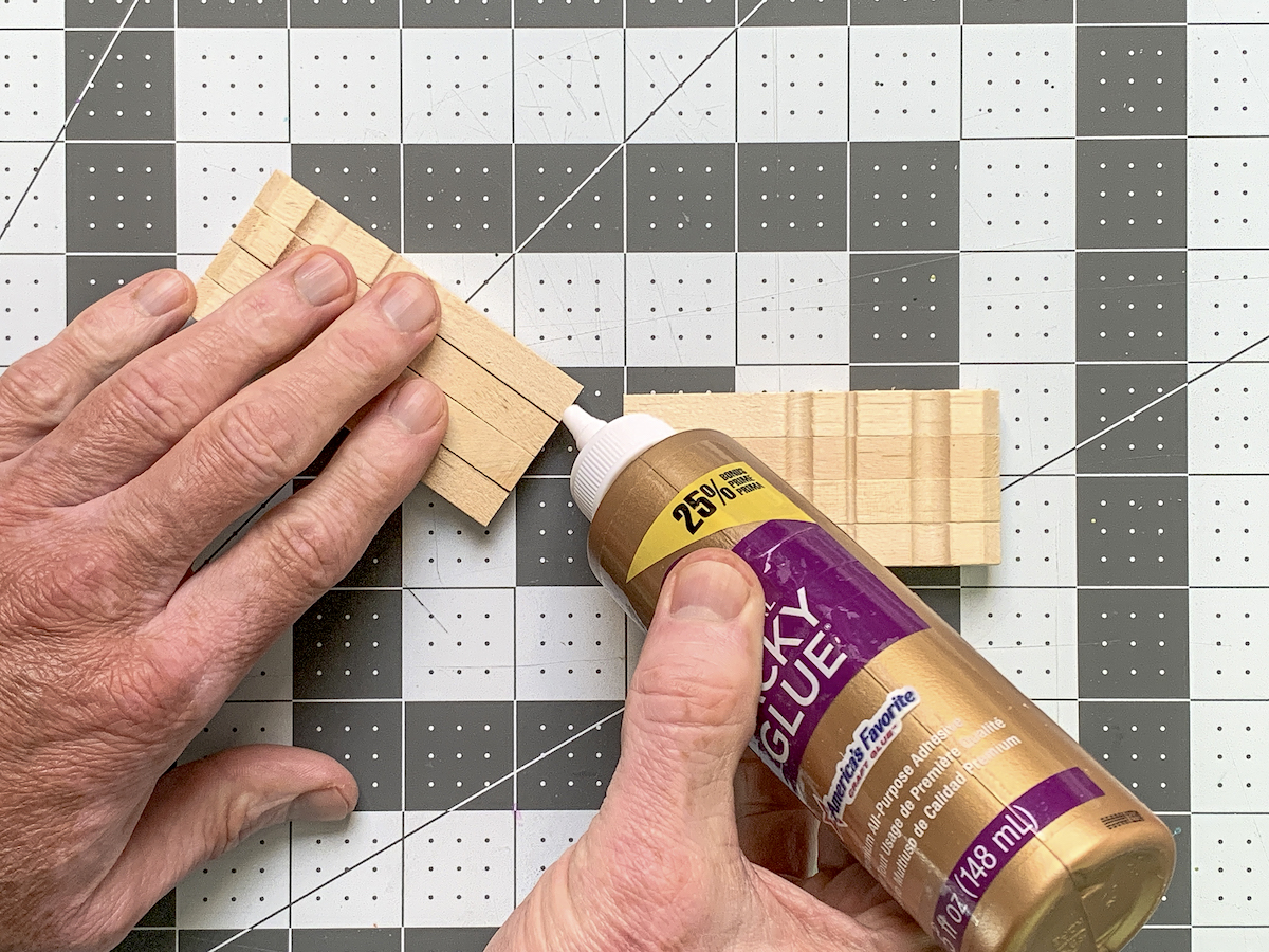 Placing glue on the edge of clothespins
