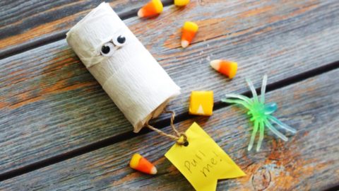 mummy pinata surrounded by candy