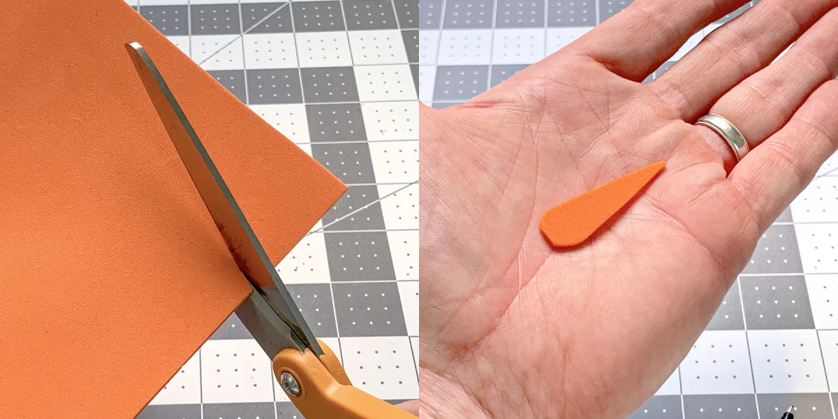 Cutting a carrot nose out of orange craft foam with scissors