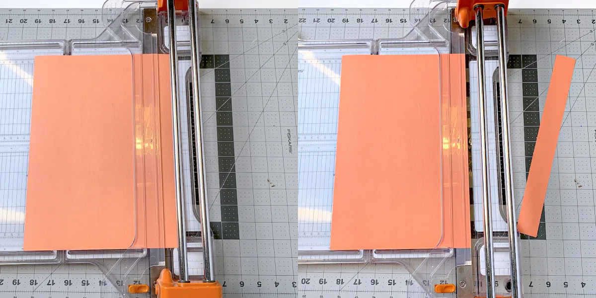 Cutting strips of construction paper with a paper cutter