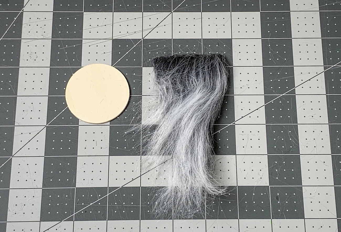 Wood circle and faux fur cut into a beard shape