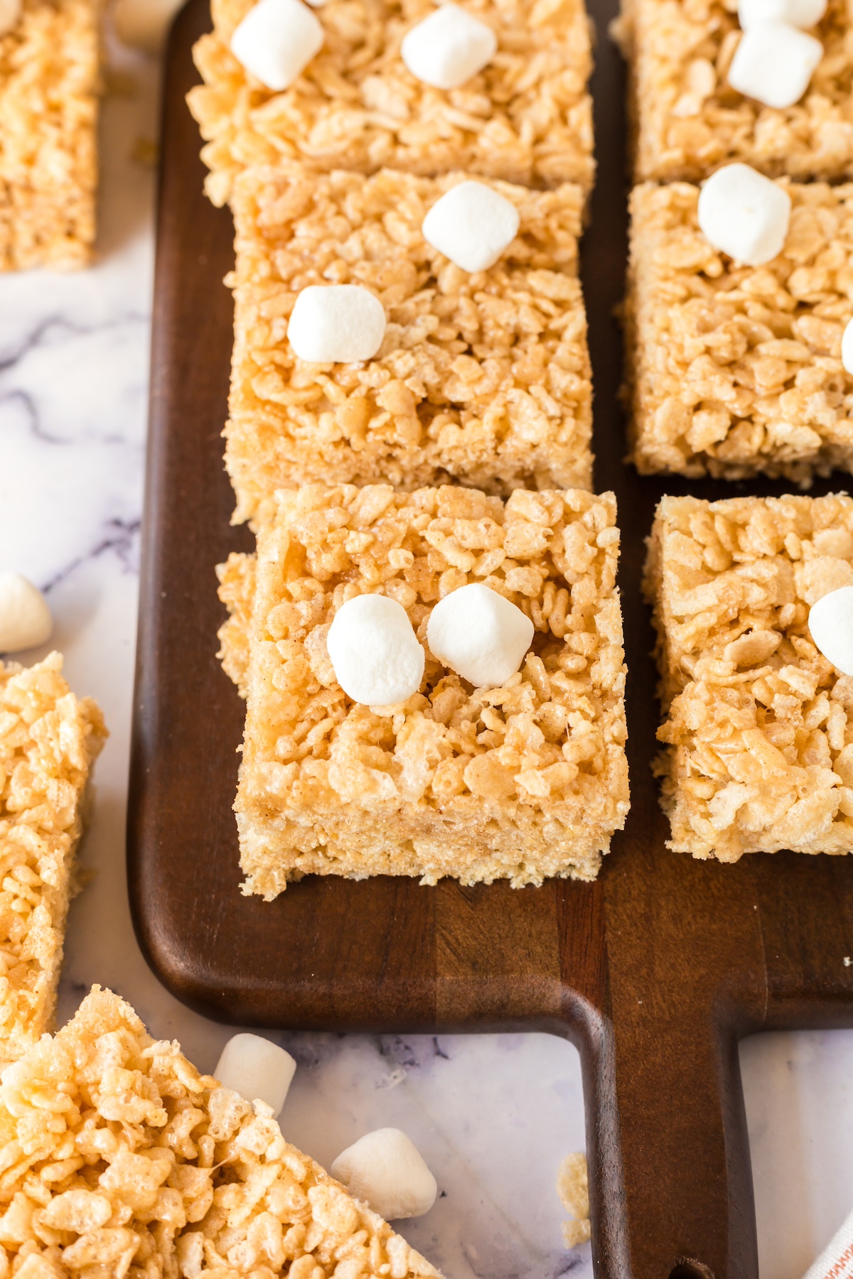 brown butter rice krispie bars on a cutting board