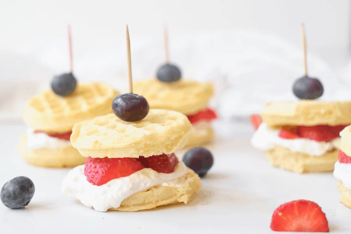 waffle sandwiches with berries and cream