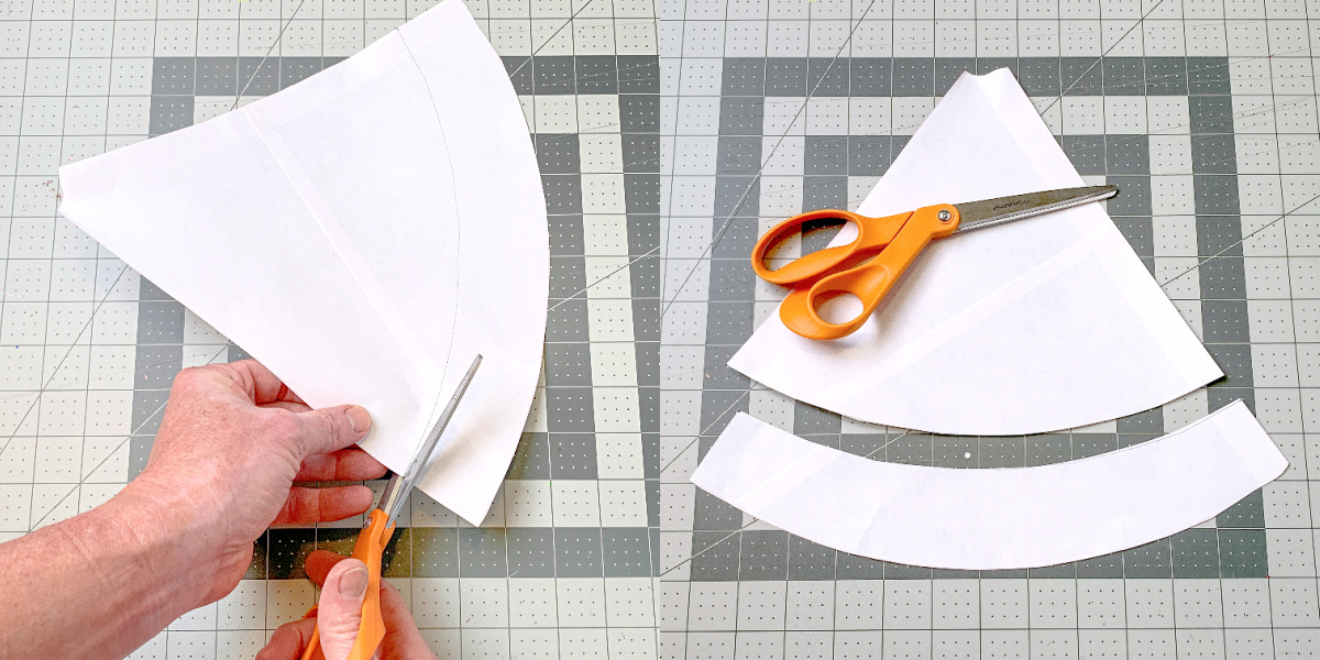 Cutting the paper template with scissors